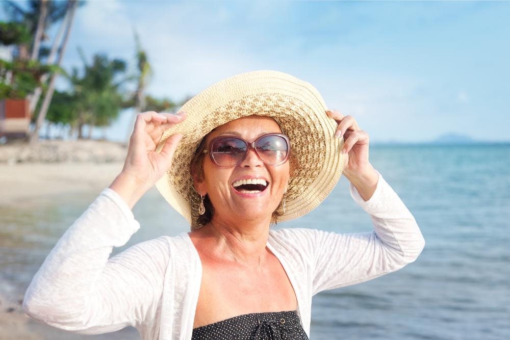 Older woman in sun hat smiling, south charlotte nc