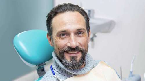 Man in dental chair smiling, charlotte nc