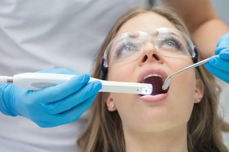 Woman getting laser dentistry treatment, south charlotte nc