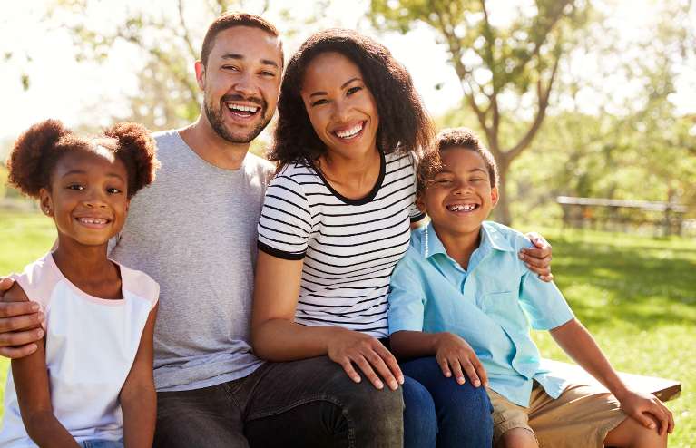 Black family smiling together, south charlotte nc