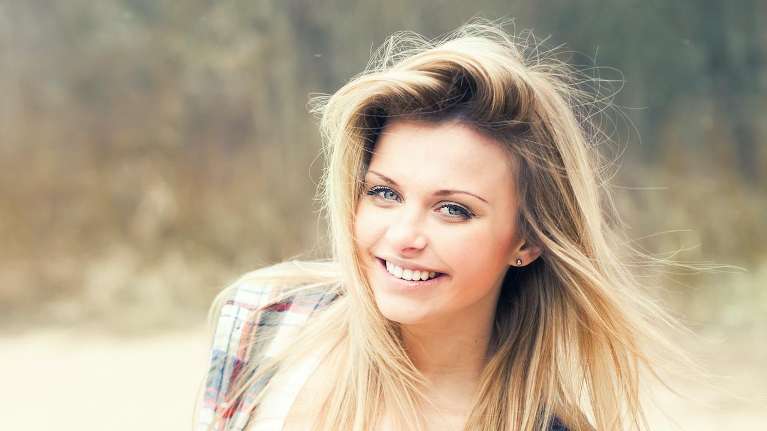 woman smiling after getting bioclear treatment in south charlotte