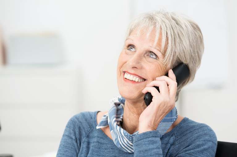 Older woman talking on the phone, south charlotte nc