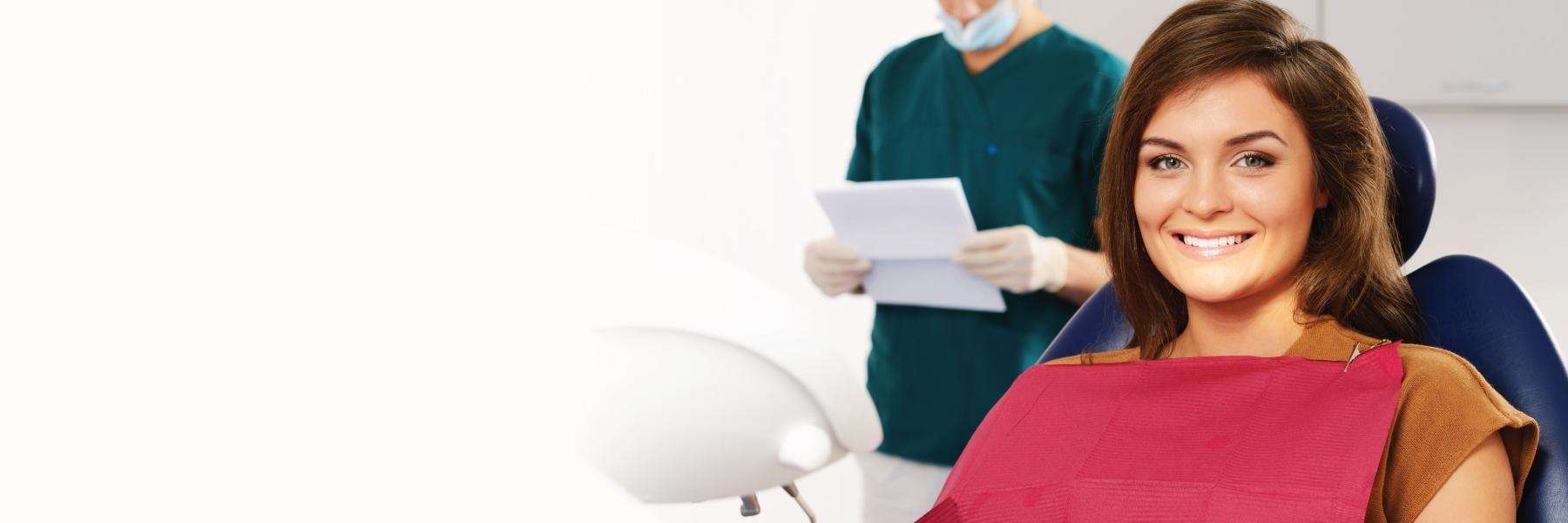 woman sitting in a dental chair, south charlotte nc