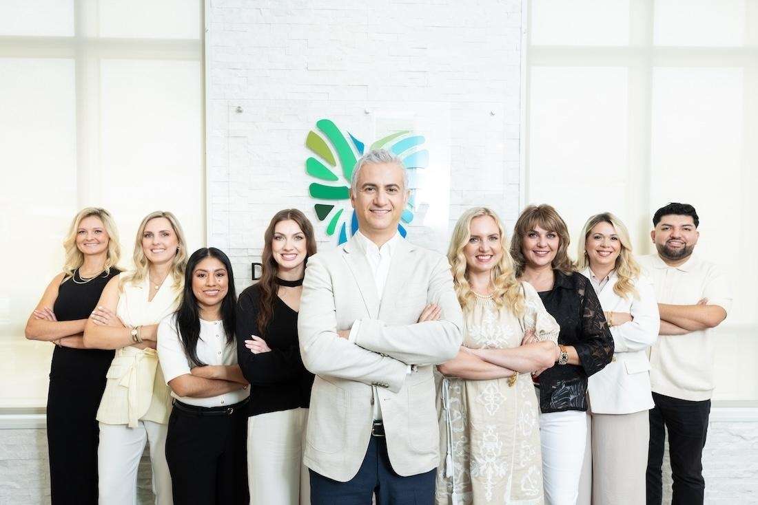 Dental Wellness of Charlotte team with arms crossed, charlotte nc